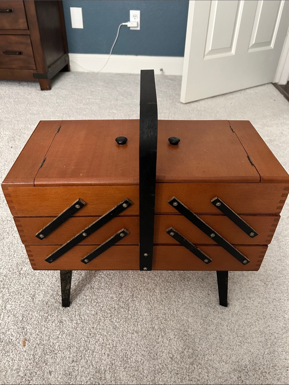 Vintage Wooden Sewing Box with Black Accents and feet.